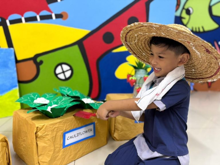 A child taking part in a Plant Day activity at Excel Kids